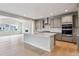 Open-concept kitchen with large island, stainless steel appliances, and abundant cabinet space at 1825 Morgan Dr, Erie, CO 80516