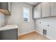 Laundry room with a single sink, window, and lots of cabinet space at 1825 Morgan Dr, Erie, CO 80516