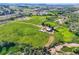 Expansive aerial view showcasing the property's land, barns, outbuildings, and serene rural setting at 11475 Us Highway 85, Littleton, CO 80125