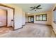 Spacious bedroom featuring carpet floors, a ceiling fan, and a window with natural light at 11475 Us Highway 85, Littleton, CO 80125