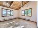 Bedroom featuring carpet floors, wood trim and vaulted ceiling with a ceiling fan at 11475 Us Highway 85, Littleton, CO 80125