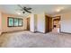Spacious bedroom with neutral carpet, natural light, and wood trim accents at 11475 Us Highway 85, Littleton, CO 80125