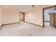 Bonus room featuring carpet floors, wood trim and two wood doors at 11475 Us Highway 85, Littleton, CO 80125