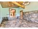 Dining area with tile floors, wood accents, and seamless transition to the adjacent living spaces at 11475 Us Highway 85, Littleton, CO 80125
