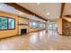 Bright living room featuring hardwood floors, exposed beams, and a decorative fireplace at 11475 Us Highway 85, Littleton, CO 80125