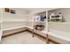Basement pantry has white shelves for storage and sits on a carpeted floor at 11475 Us Highway 85, Littleton, CO 80125