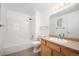 Bathroom with shower over tub, tiled walls, and vanity at 444 17Th St # 802, Denver, CO 80202