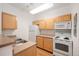 Bright kitchen featuring modern appliances, light wood cabinets, and durable countertops at 444 17Th St # 802, Denver, CO 80202