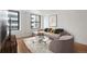 Inviting living room with a plush sectional sofa, natural light, and decorative accents at 444 17Th St # 802, Denver, CO 80202
