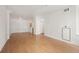 Open and spacious living space with light wood floors and white walls at 444 17Th St # 802, Denver, CO 80202