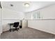 Basement office with gray carpet and minimalist decor with a window for natural light at 5945 W Colgate Pl, Denver, CO 80227