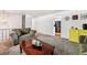 This carpeted living room has couches, a coffee table, and access to the kitchen at 5945 W Colgate Pl, Denver, CO 80227