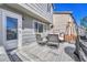 Outdoor back deck featuring outdoor furniture, BBQ grill, and door to the home at 9851 Castle Ridge Cir, Highlands Ranch, CO 80129