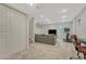 Finished basement with neutral colors, stairs, couch, TV, and workout area at 9851 Castle Ridge Cir, Highlands Ranch, CO 80129