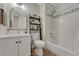 Full bath with combo tub and shower, modern sink, and wood-look floor at 9851 Castle Ridge Cir, Highlands Ranch, CO 80129