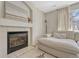 Cozy fireplace featuring tile surround and a plush couch at 9851 Castle Ridge Cir, Highlands Ranch, CO 80129