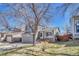 Charming two-story home featuring a well-maintained front yard, attached garage, and inviting entrance at 9851 Castle Ridge Cir, Highlands Ranch, CO 80129