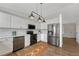 Modern kitchen featuring stainless steel appliances, white cabinets and gorgeous countertops at 9851 Castle Ridge Cir, Highlands Ranch, CO 80129