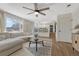 Spacious living room with hardwood floors, ceiling fan and an open floor plan at 9851 Castle Ridge Cir, Highlands Ranch, CO 80129