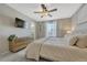 Comfortable main bedroom with ceiling fan, natural light, and neutral tones at 9851 Castle Ridge Cir, Highlands Ranch, CO 80129