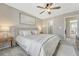 Bright main bedroom with ceiling fan, natural light, and a clean aesthetic at 9851 Castle Ridge Cir, Highlands Ranch, CO 80129