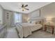 Bright main bedroom with ceiling fan, natural light, and soft textures at 9851 Castle Ridge Cir, Highlands Ranch, CO 80129