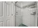 Shower with glass doors and white subway tile at 9851 Castle Ridge Cir, Highlands Ranch, CO 80129