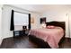 Relaxing bedroom featuring dark wood floors at 1825 S Pitkin Cir # 10, Aurora, CO 80017
