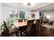 Bright dining area with hardwood floors, complemented by a window view and comfortable seating at 1825 S Pitkin Cir # 10, Aurora, CO 80017