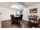 Comfortable dining room with natural light, dark wood floors, and wine storage at 1825 S Pitkin Cir # 10, Aurora, CO 80017