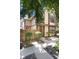 Charming tan two-story home with a wood fence and well-maintained landscaping and rocks at 1825 S Pitkin Cir # 10, Aurora, CO 80017