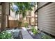 Charming two-story home showcasing the front yard with lush landscaping and inviting entryway at 1825 S Pitkin Cir # 10, Aurora, CO 80017