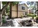 Pleasant home exterior surrounded by mature trees, complemented by a paved pathway and well-kept shrubbery at 1825 S Pitkin Cir # 10, Aurora, CO 80017