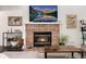 Cozy fireplace with brick surround creates a warm ambiance in the living space at 1825 S Pitkin Cir # 10, Aurora, CO 80017