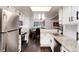 Modern kitchen with white cabinets, stainless steel appliances, and granite countertops at 1825 S Pitkin Cir # 10, Aurora, CO 80017