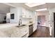 Well-lit kitchen with granite countertops, stainless steel appliances, and ample cabinet space for storage at 1825 S Pitkin Cir # 10, Aurora, CO 80017