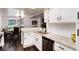 Well-maintained kitchen featuring white cabinets, granite countertops, and stainless steel appliances at 1825 S Pitkin Cir # 10, Aurora, CO 80017
