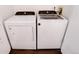 Bright laundry room features white Whirlpool washer and dryer at 1825 S Pitkin Cir # 10, Aurora, CO 80017