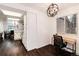 Home office features dark floors, natural light, and view into the kitchen at 1825 S Pitkin Cir # 10, Aurora, CO 80017