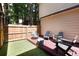Charming patio features comfortable seating, string lights, and a private fenced yard at 1825 S Pitkin Cir # 10, Aurora, CO 80017