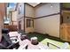 Inviting outdoor patio features stylish chairs, ambient lighting and artificial turf at 1825 S Pitkin Cir # 10, Aurora, CO 80017
