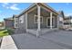 Cozy back porch with string lights and ample space for outdoor entertaining at 5723 Berry Ridge Way, Castle Rock, CO 80104