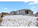 Backyard showcasing the home's exterior, lawn, and patio at 5723 Berry Ridge Way, Castle Rock, CO 80104