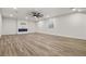 Bright basement featuring laminate flooring and an electric fireplace at 5723 Berry Ridge Way, Castle Rock, CO 80104