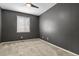Bedroom featuring neutral carpeting, a window and light gray walls at 5723 Berry Ridge Way, Castle Rock, CO 80104