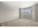 Neutral bedroom with bay window and carpeted floors at 5723 Berry Ridge Way, Castle Rock, CO 80104
