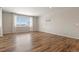 Spacious bedroom with a large window providing natural light and wood floors at 5723 Berry Ridge Way, Castle Rock, CO 80104