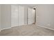 Neutral bedroom with carpet, closet, and an entry door at 5723 Berry Ridge Way, Castle Rock, CO 80104