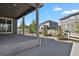 Covered patio with string lights overlooking a landscaped backyard and fenced-in neighborhood at 5723 Berry Ridge Way, Castle Rock, CO 80104