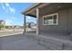 Relaxing covered patio with decorative string lights, offering a view of the neighborhood at 5723 Berry Ridge Way, Castle Rock, CO 80104